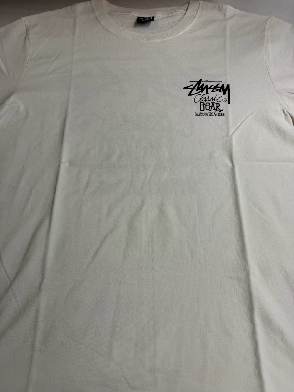 Stussy White Short-Sleeve Tee with Black Chest Logo